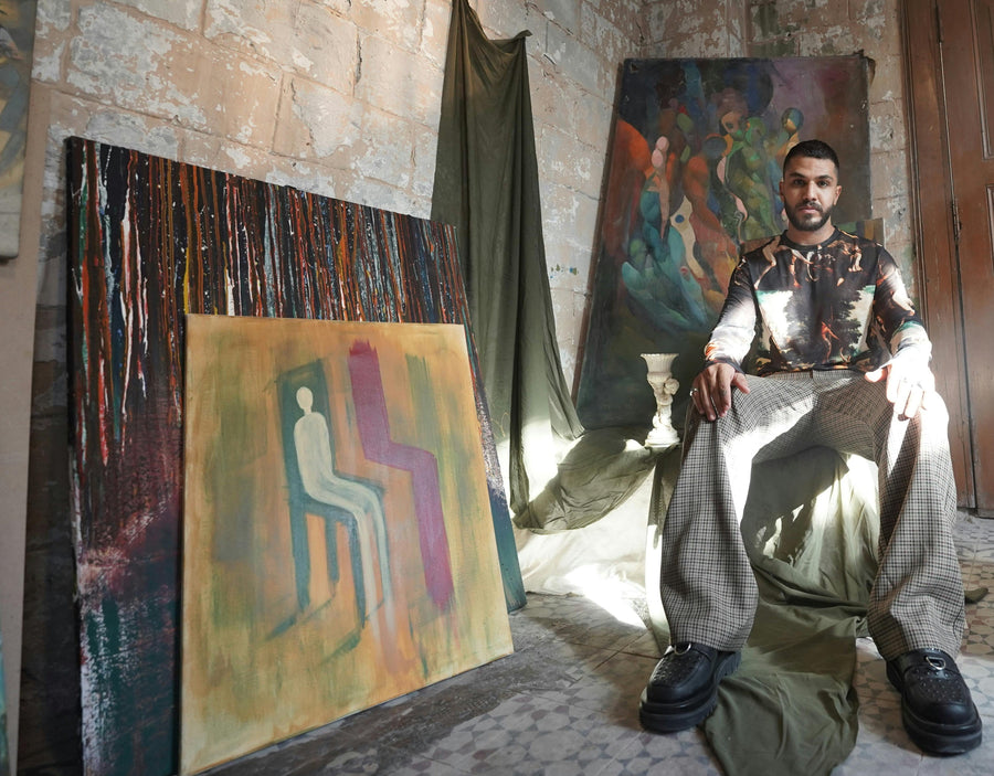 Atmospheric artist studio with sunlight and original paintings, representing the story-driven focus of the Mitsooz art collection.