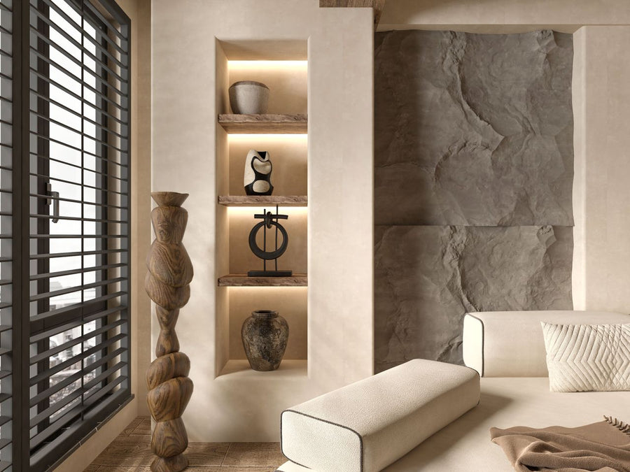 A wide horizontal view of a singular sculptural wall object in a luxury interior; image found on Mitsooz to illustrate how art can refuse a room to create deeper tension.