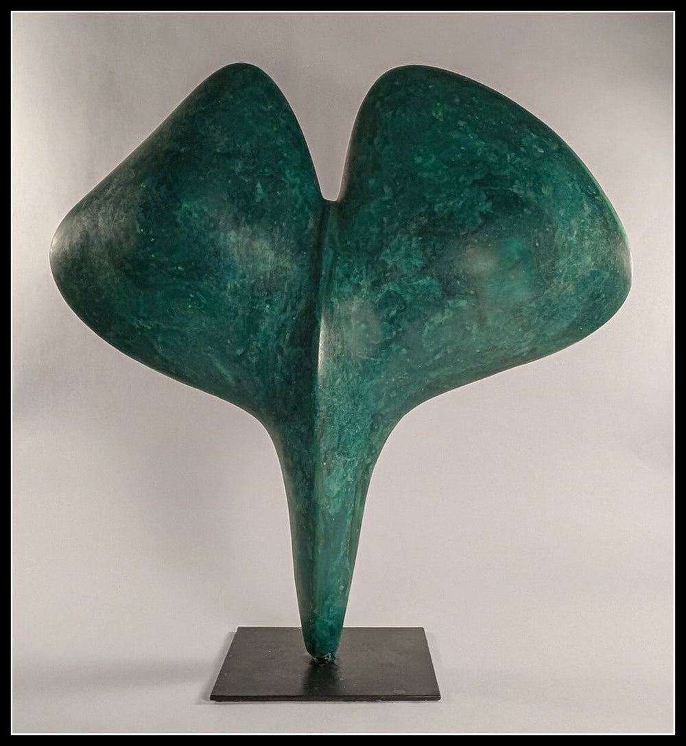 A large vertical bespoke bronze sculpture titled Gingko Leaf by Andree Brown featuring a hand-formed fan shape with a mottled verdigris patina on a black metal base on Mitsooz.