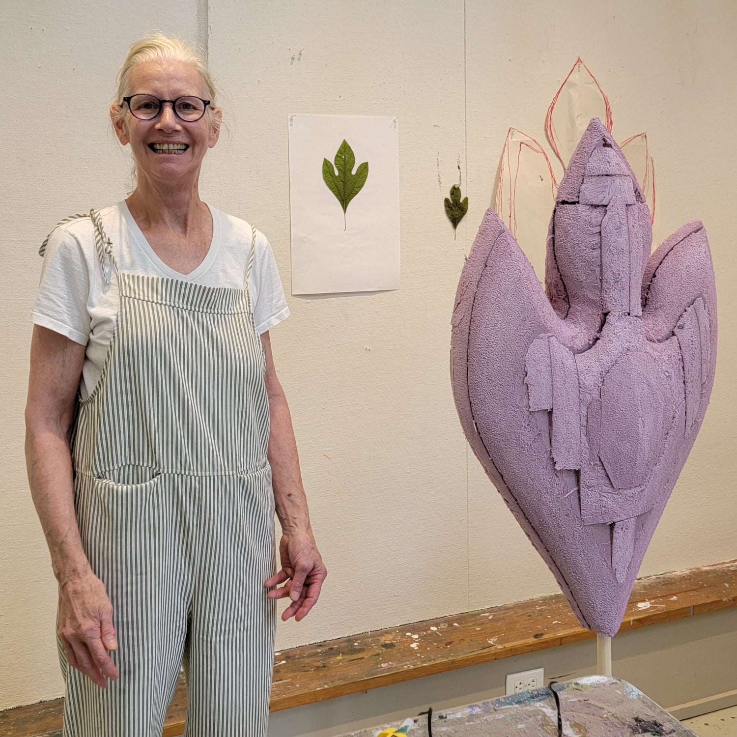 Andree Brown in her studio during the development of a new sculptural Work. A green leaf is pinned to the wall as a point of departure for a large-format hand-formed piece: illustrating the transition from sensation to form. Mitsooz
