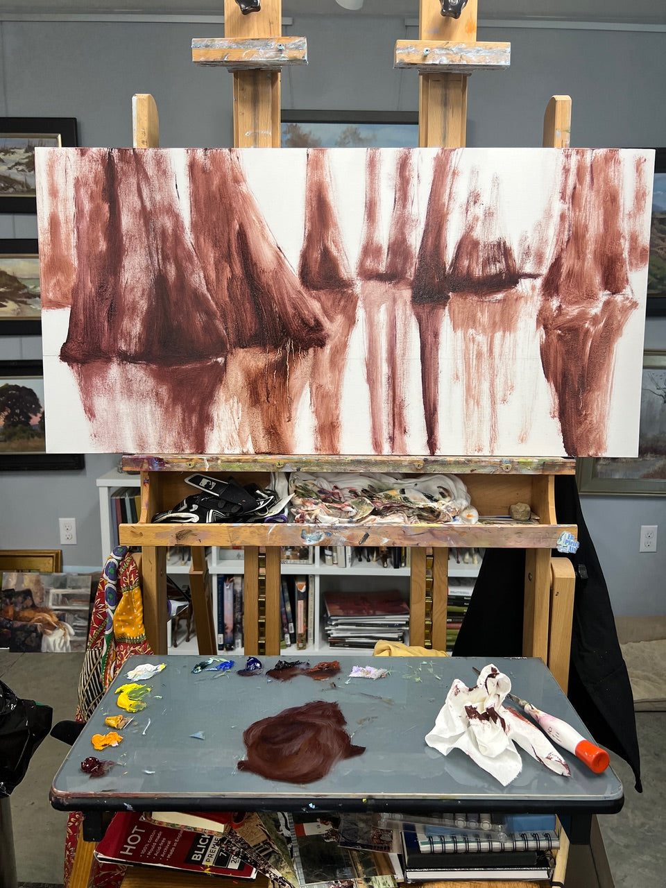 Carol Roark's artistic intention is captured as she paints plein air on a wooden boardwalk. As a Mitsooz featured artist, her goal is to document the atmospheric vibration and heavy light of the Southern landscape in real-time.