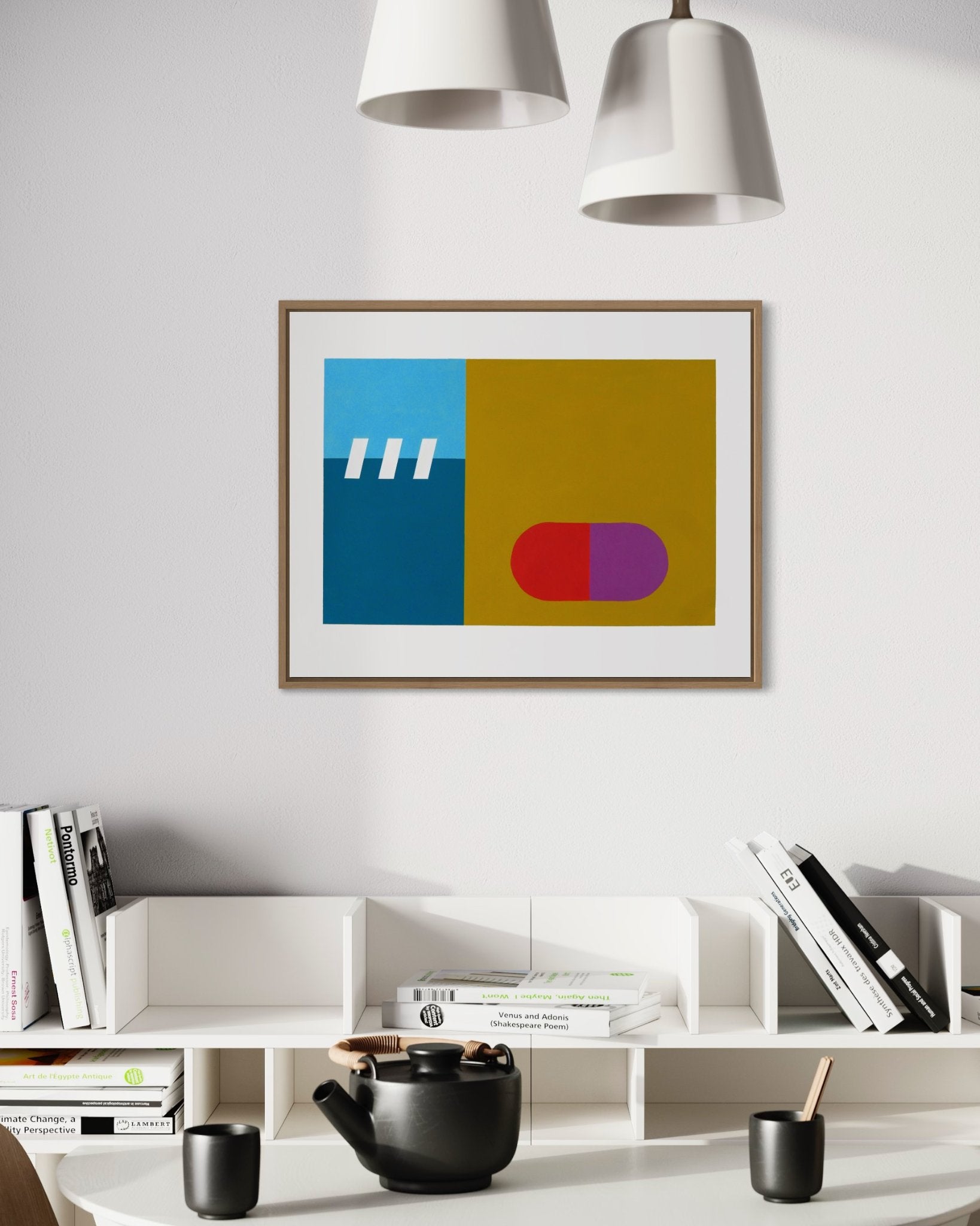 A horizontal framed original abstract painting titled Subconscious #1 by Holly McWhorter hanging on a white wall in a modern interior. The artwork features bold geometric fields of teal, blue, and ochre with a red and purple capsule shape. It is styled above a white contemporary bookshelf containing design books and a black ceramic teapot, reflecting a minimalist Copenhagen aesthetic on Mitsooz.