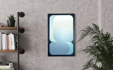 A vertical 15x24 original abstract painting titled Setting by Kevin Cross, featuring cooling seafoam and misty blue geometric gradients on foam-backed canvas. The artwork is displayed on a textured grey concrete wall in an industrial-style interior, positioned next to black pipe shelving with books and a vibrant green floor plant on Mitsooz.