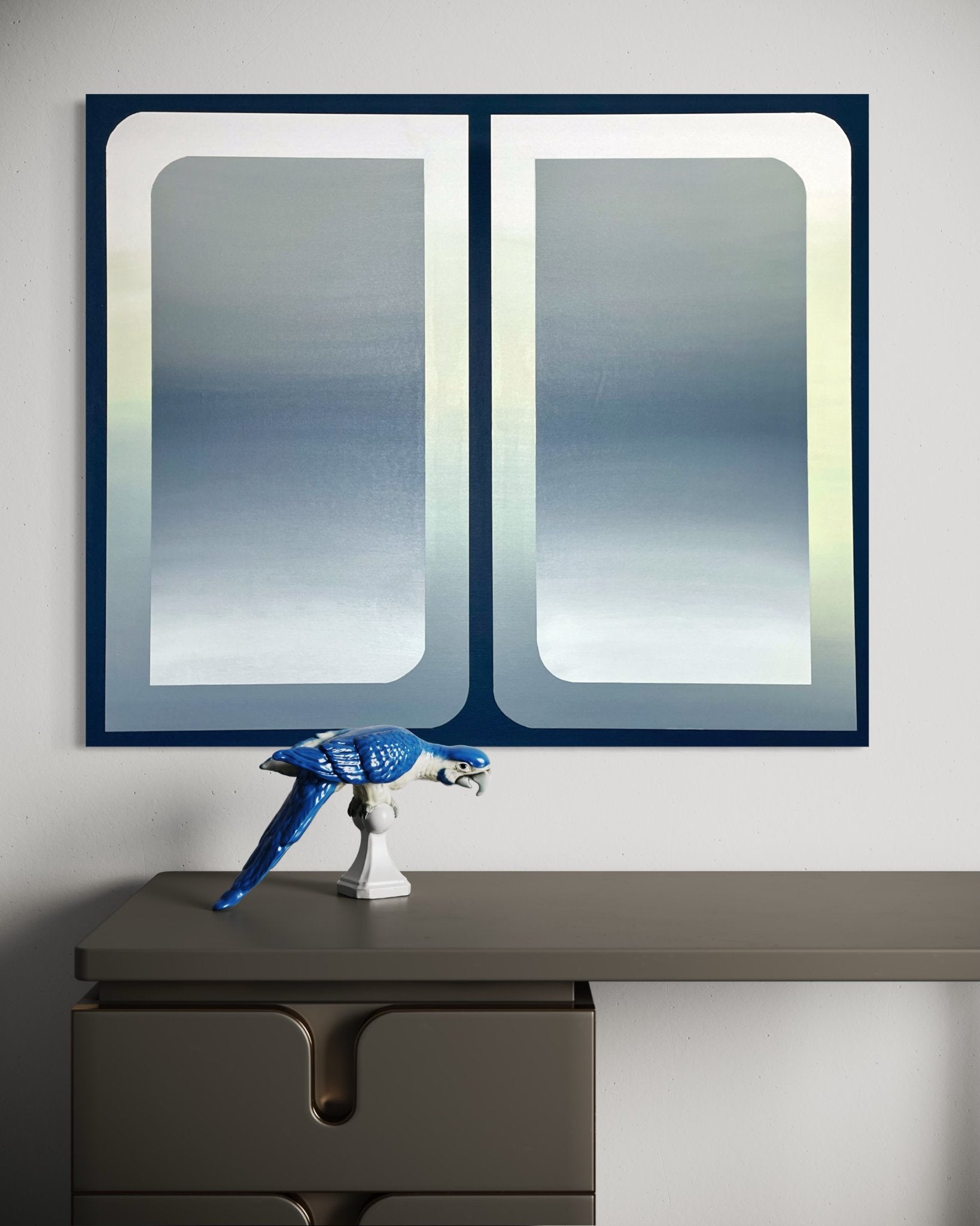 A 30x36 original atmospheric abstract painting titled The View by Kevin Cross displayed in a sophisticated interior above a modern desk with a blue parrot sculpture on Mitsooz.