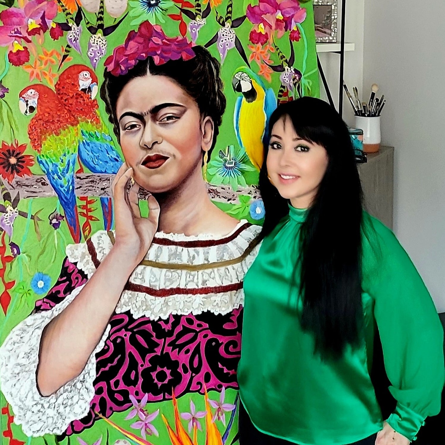 Nersel Muehlen in her studio with a large-scale oil painting. Illustrating the vibrant color transitions and Old Masters' technique used to create her contemporary Work.