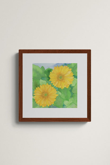 Square original watercolor painting titled Two Yellow Gerbera Daisies by Ruth Wall featuring two golden blooms and lush green leaves in a mahogany frame on Mitsooz.